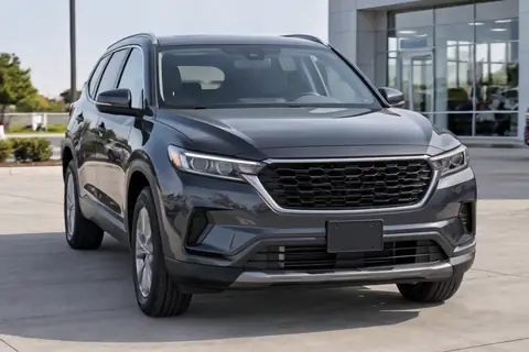 Mid-size SUV on a dealer lot, video frame at 2.5s