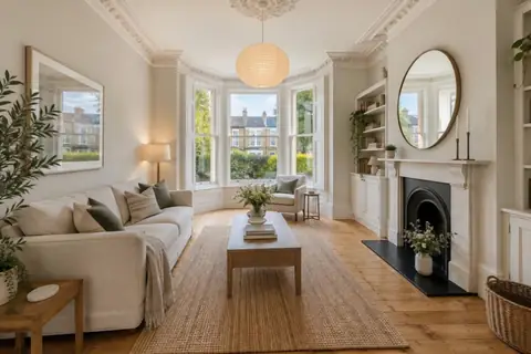 Period bay-window living room, video frame at 0s